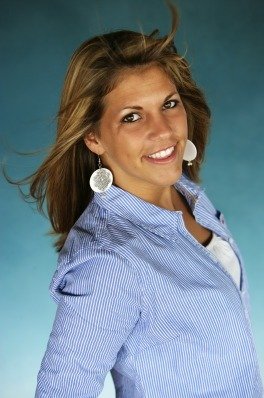 a photo of Erica with a light blue shirt and hair blowing