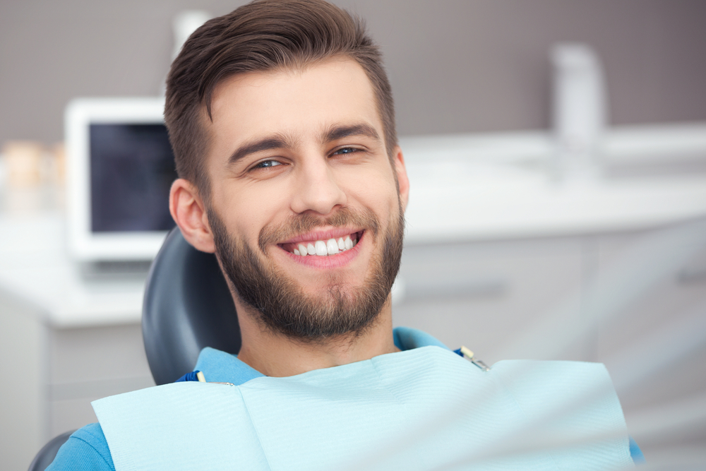 man smiling in dental chair