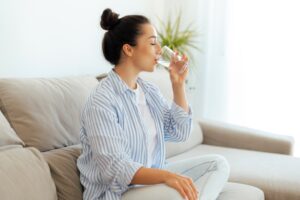 woman drinking glass of water